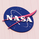 Illustration for article titled The Saga of NASA's Short-Lived "Lost" Logo